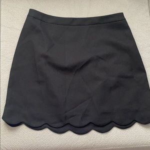 Black scalloped mini skirt